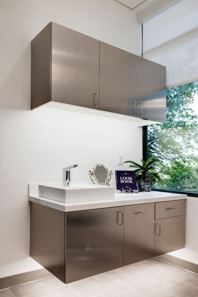 Modern bathroom with sleek cabinetry and sink.