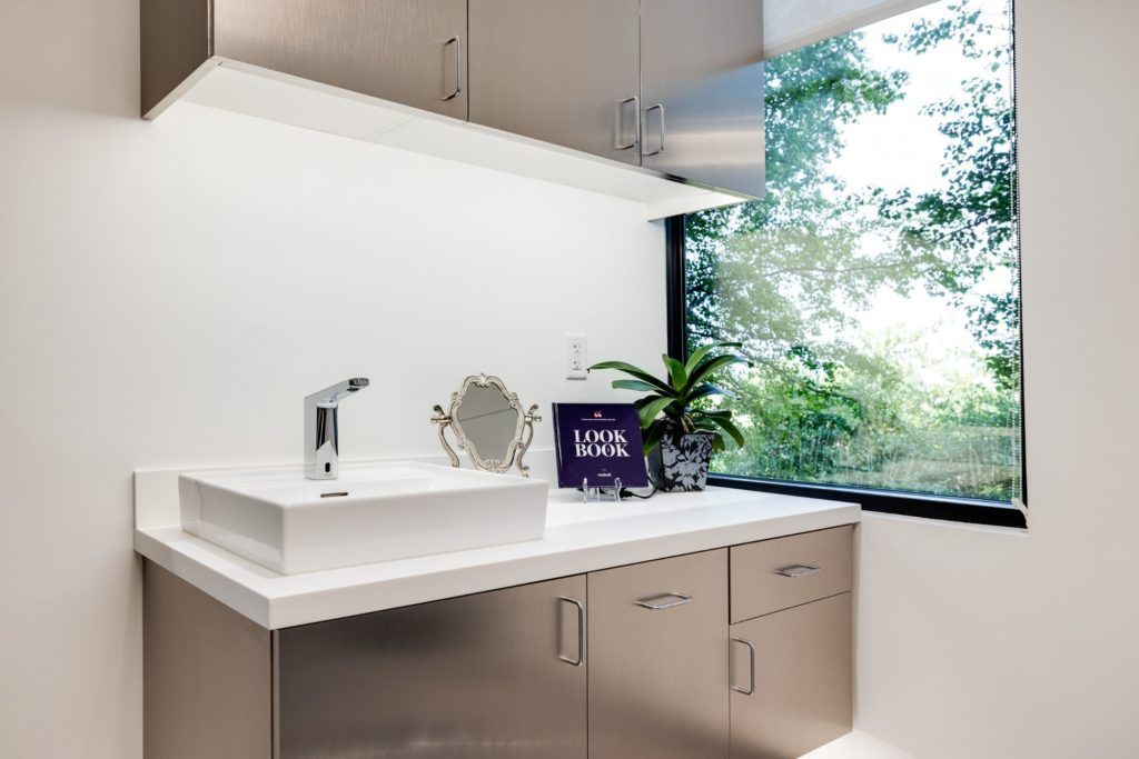 Modern bathroom sink with natural light.