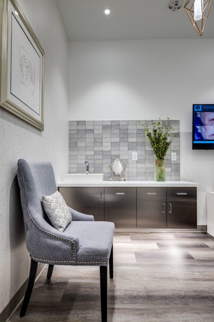 Modern waiting area with chair and decor.