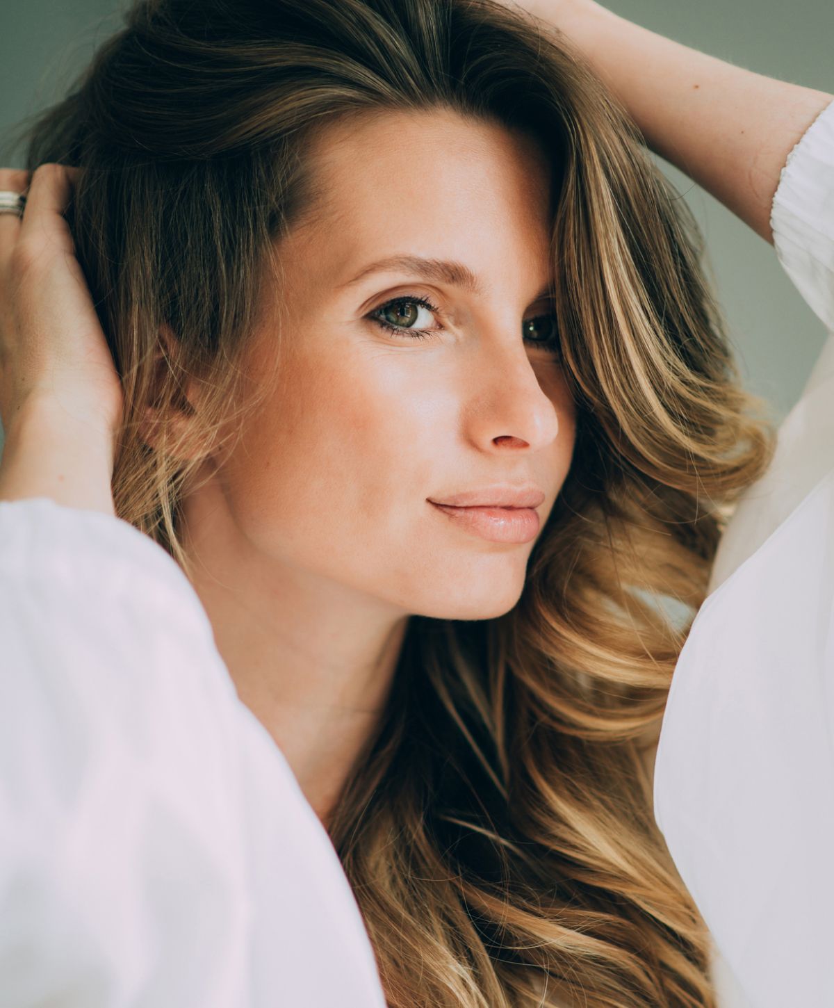 Portrait of a woman with long, wavy hair.