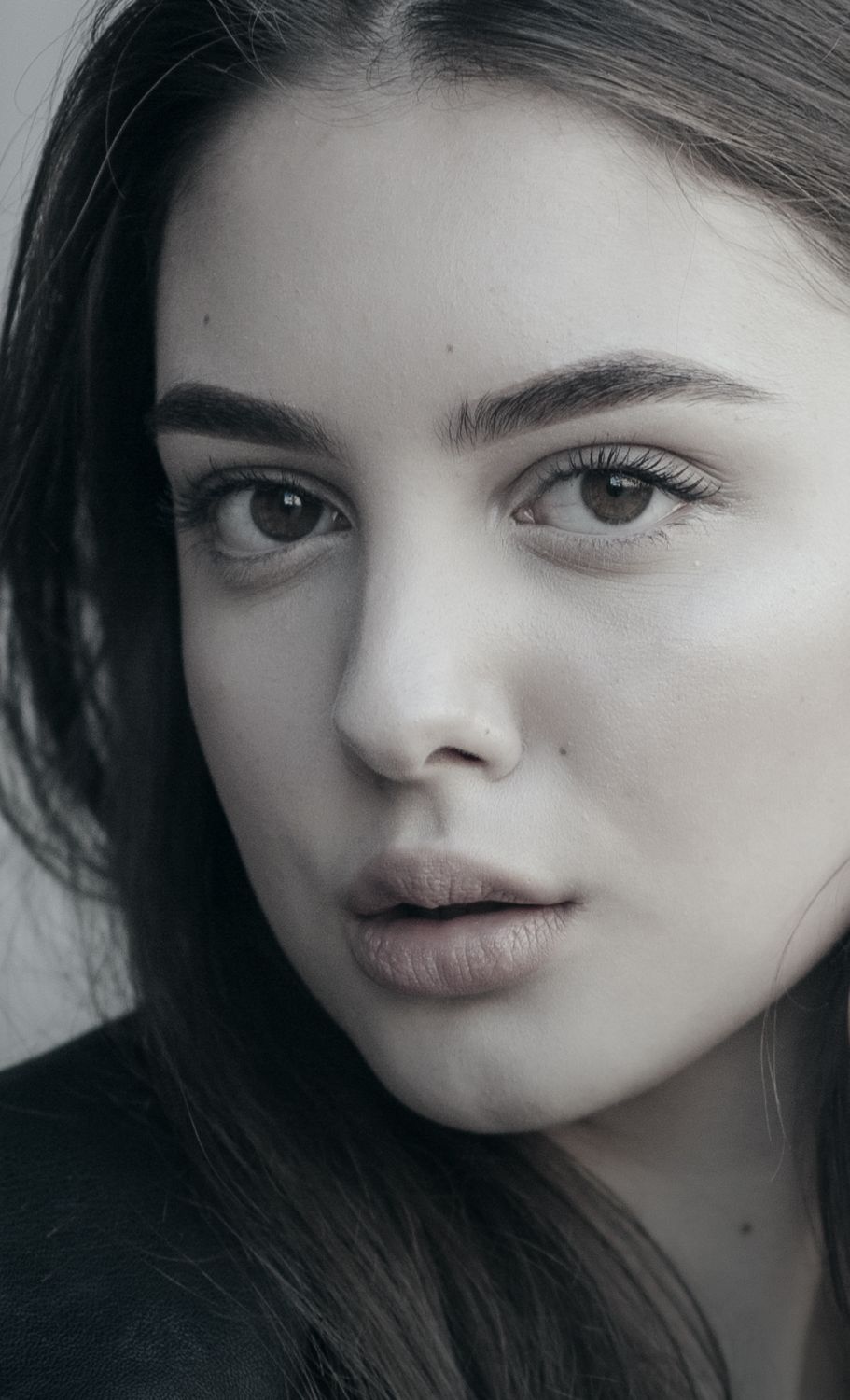 Close-up of a Denver plastic surgery model with striking features.