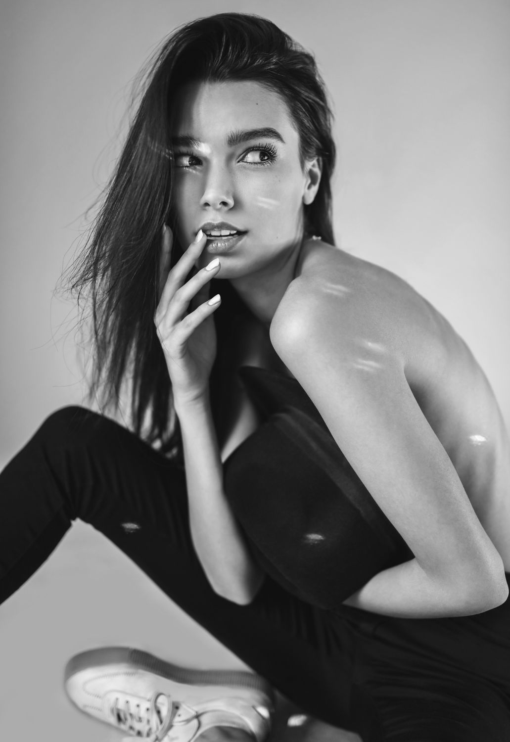 Black and white portrait of thoughtful young Denver plastic surgery model.