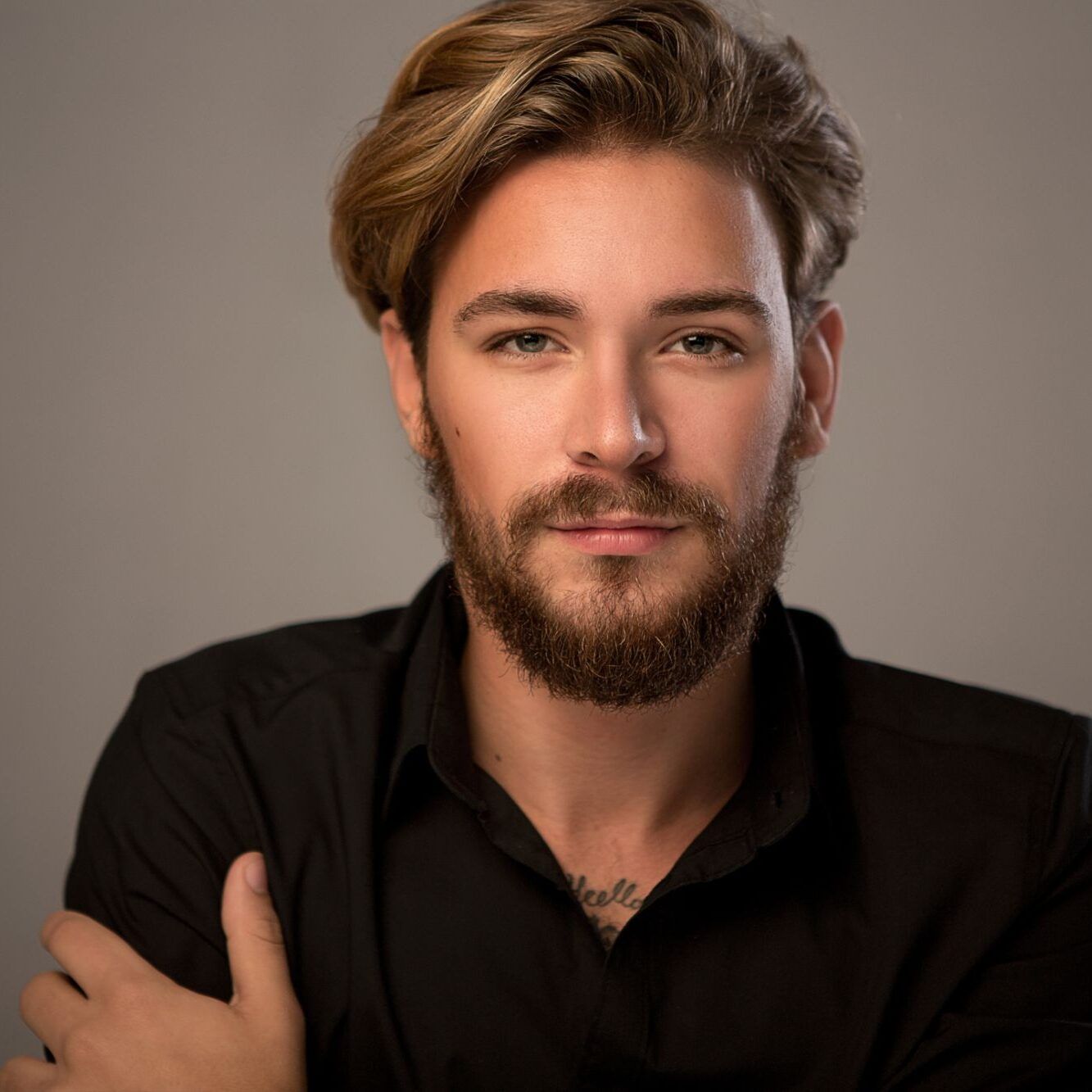Portrait of a young man with a beard.