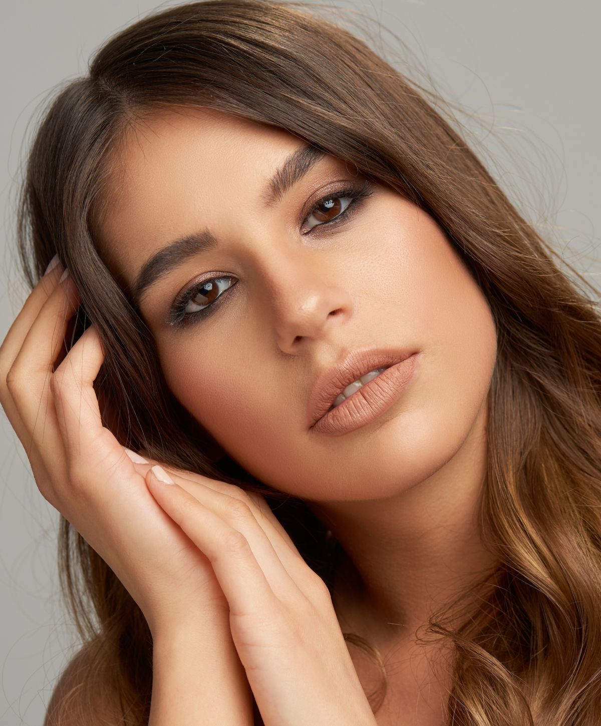 Close-up portrait of a woman with soft expression.