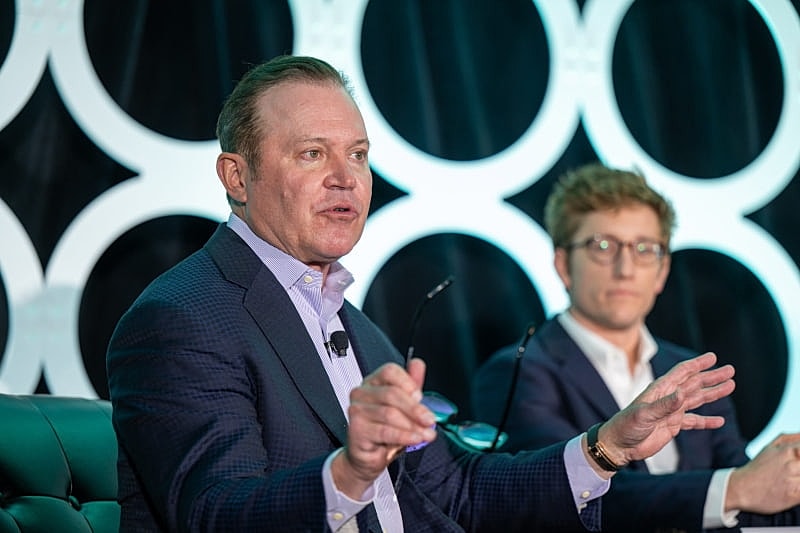Panel discussion with two speakers on stage.