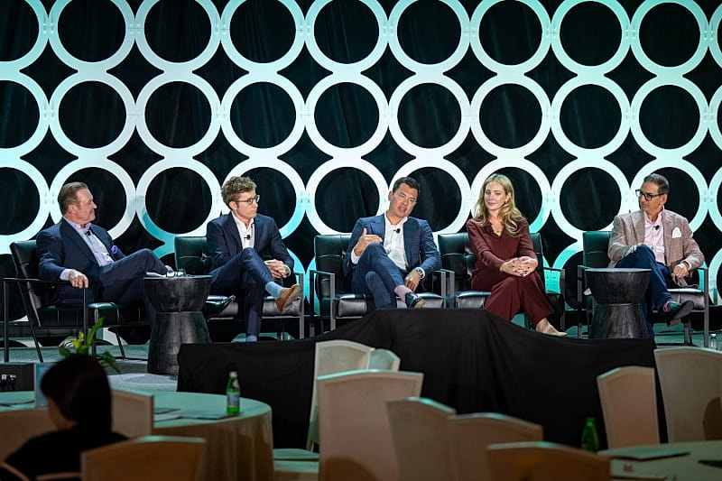 Panel discussion with five speakers onstage.