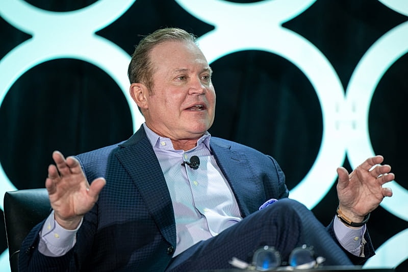 Man speaking at a conference event.