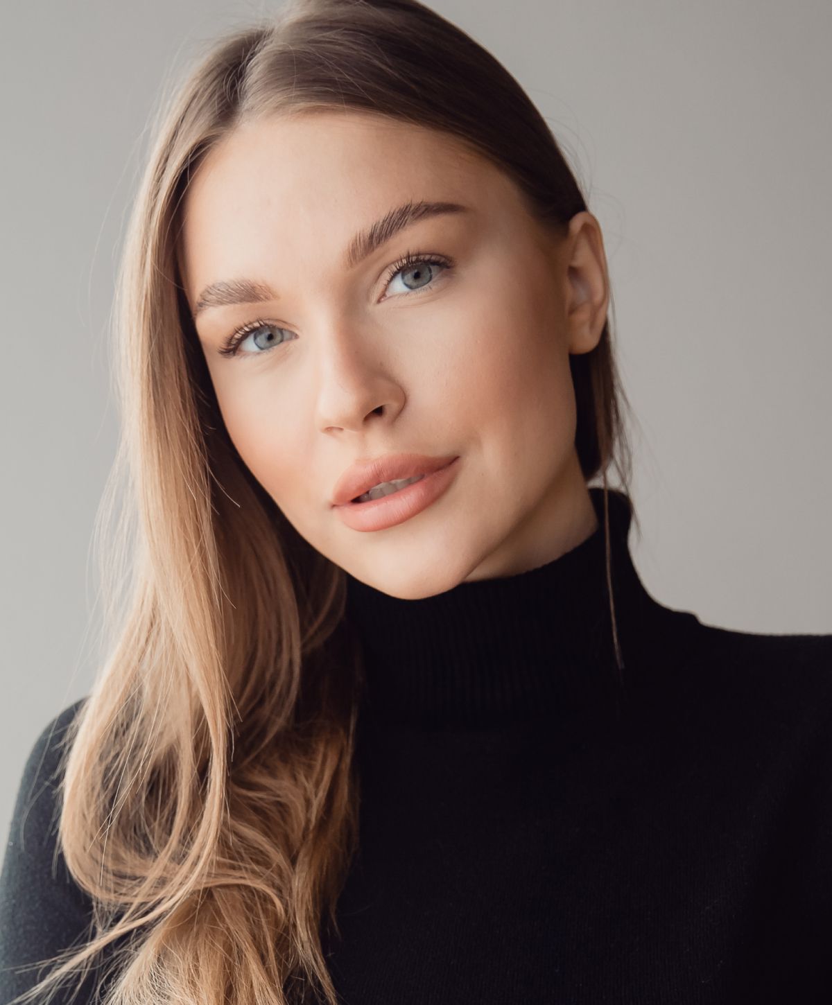 Portrait of a woman with long hair.