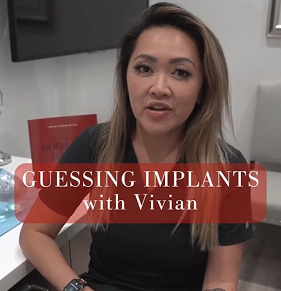 Denver plastic surgery staff, Vivian, discussing implant guessing game.
