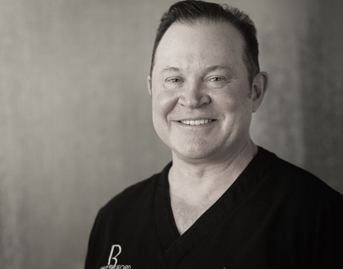 Portrait of a man with Beauty by Buford branding. 