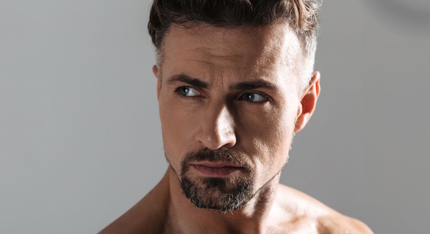 Close-up of a man with intense expression.